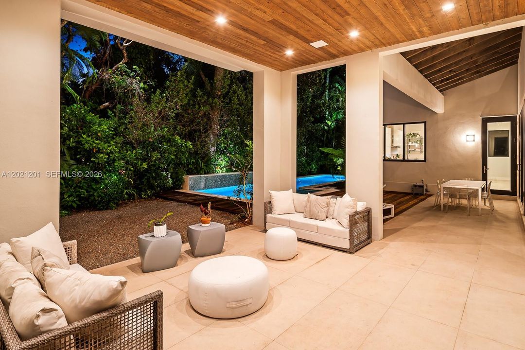 Covered outdoor living room with seamless resort-inspired ambiance