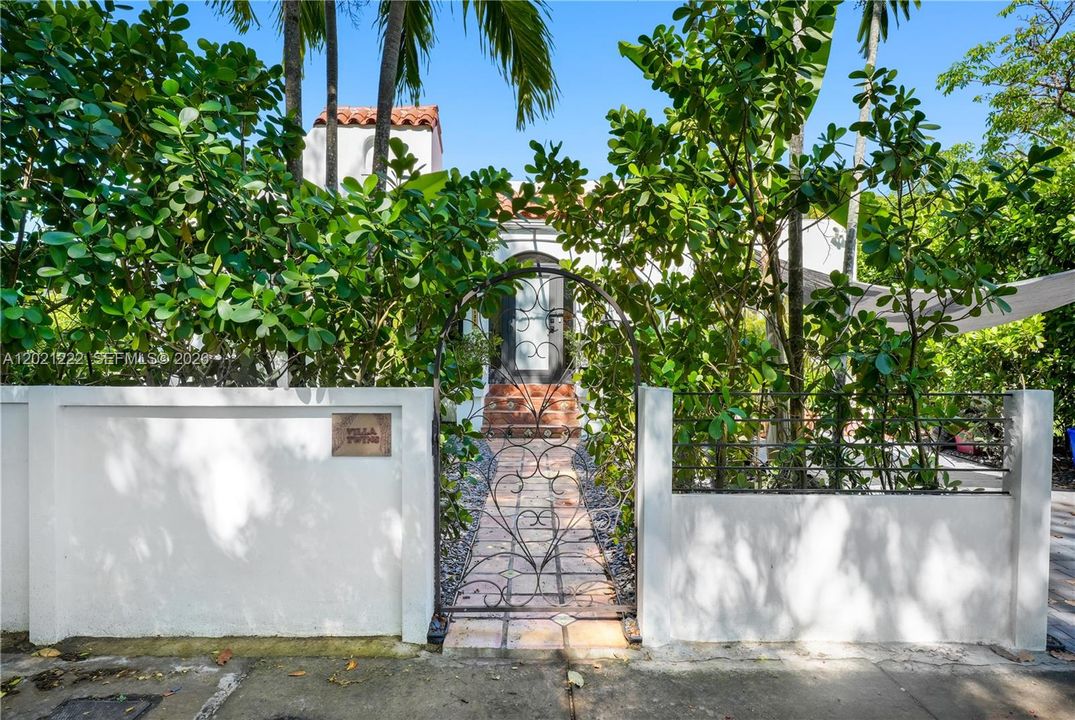 Front Property Entrance with Privacy Wall & Tall Clusia Hedges