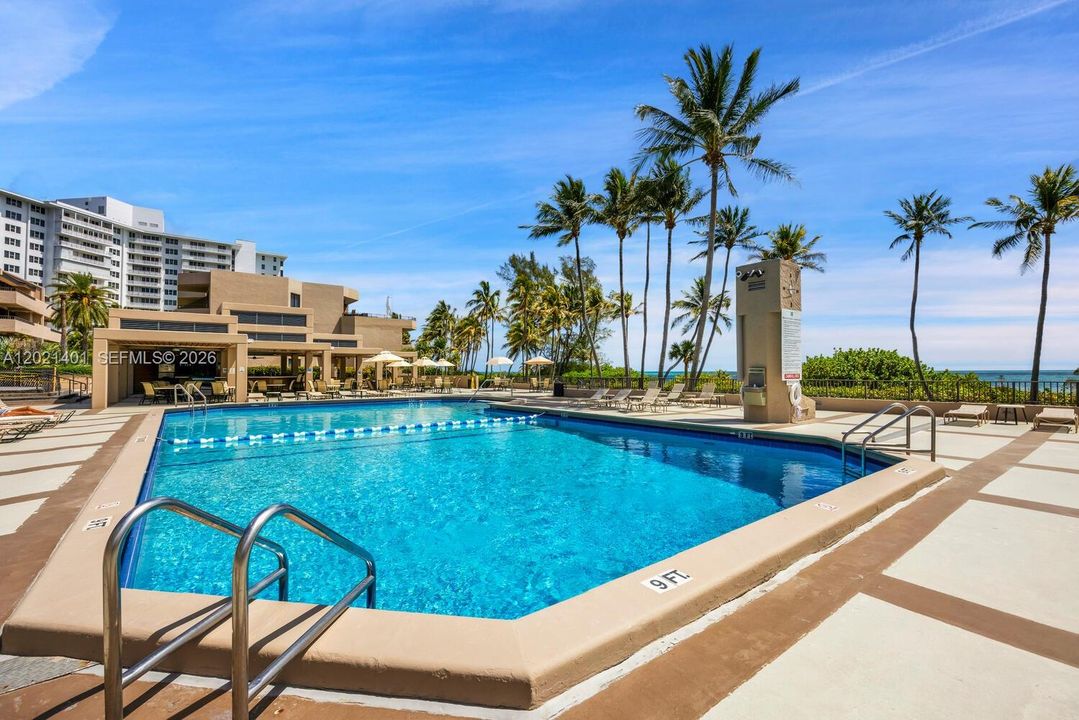 Key Colony's oceanfront pool with access to the beach. Walk to the Key Biscayne Lighthouse or Crandon Beach. Chair service and umbrellas at the beach.