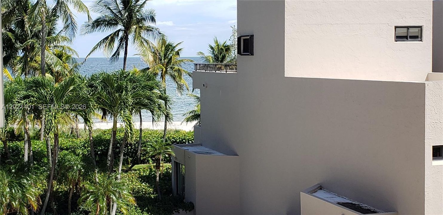 Sit on your balcony and enjoy a peek of the ocean and a short walk to the beach.