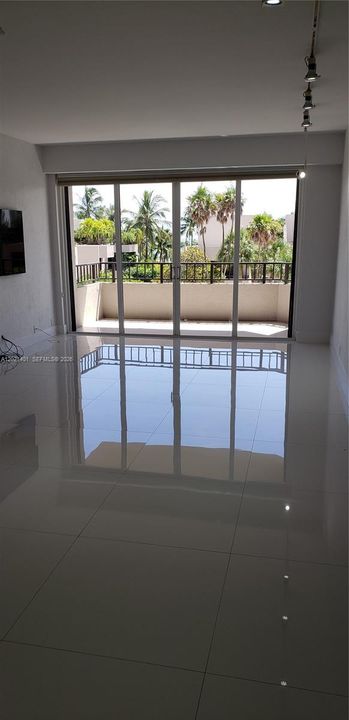 Living/dining area with access to the balcony.