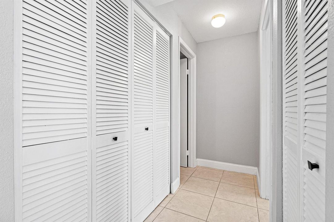 Hallway w/ laundry closet