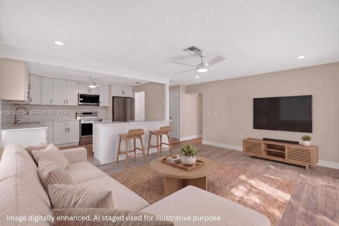 Bright family room space facing backyard for you to hang out in connected to kitchen. With Solar Shades. Virtual staging.
