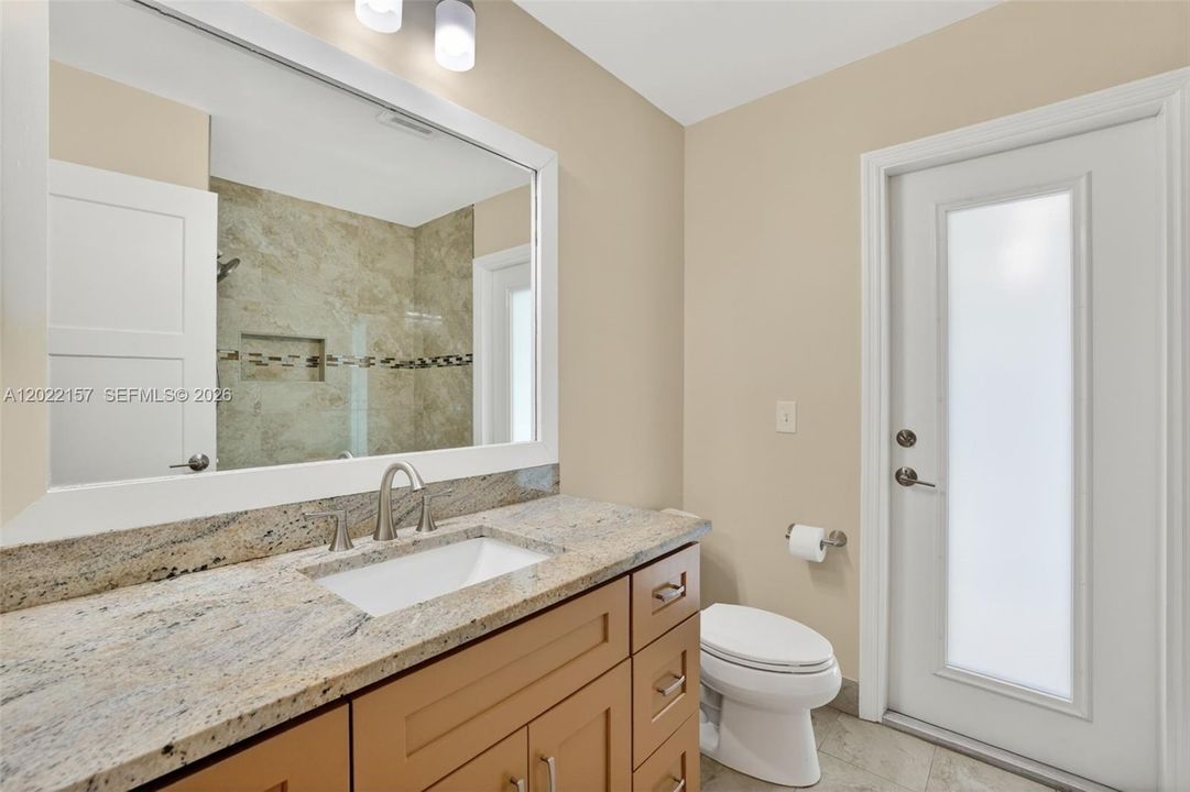 Cabana Bathroom, door to pool area.