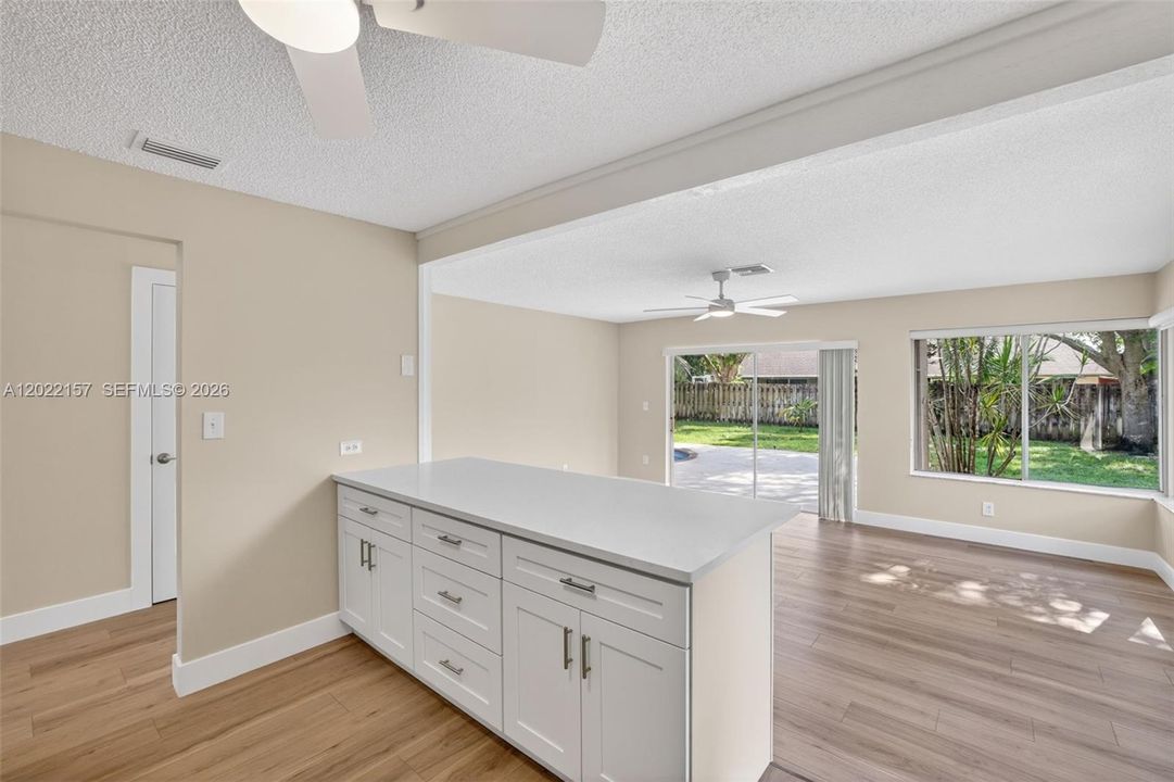 New beautiful kitchen w/ White Shaker style, slow close cabinets, quartz counters, and BRAND NEW appliances connected to family room