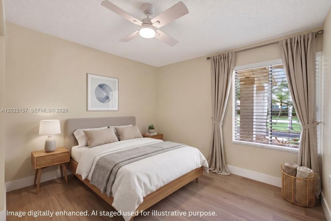 Guest bedroom overlooking front of house. Virtual Staging