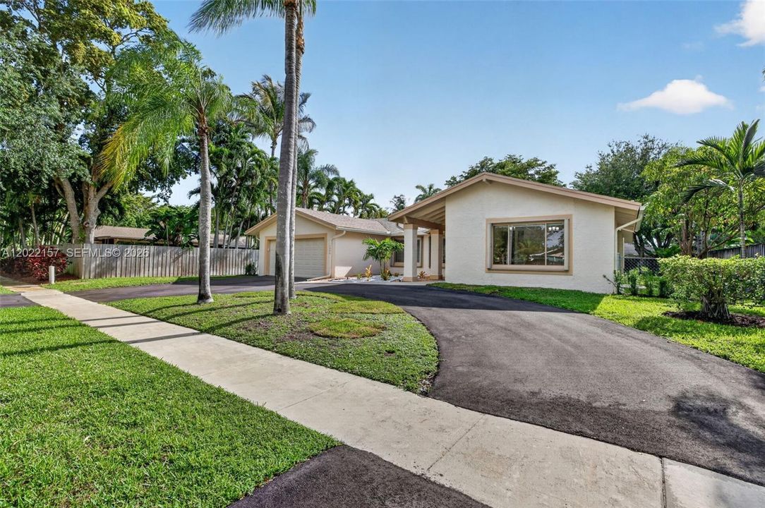 Front of House w/ large circular driveway, gorgeous curb appeal and new front entrance landscaping!