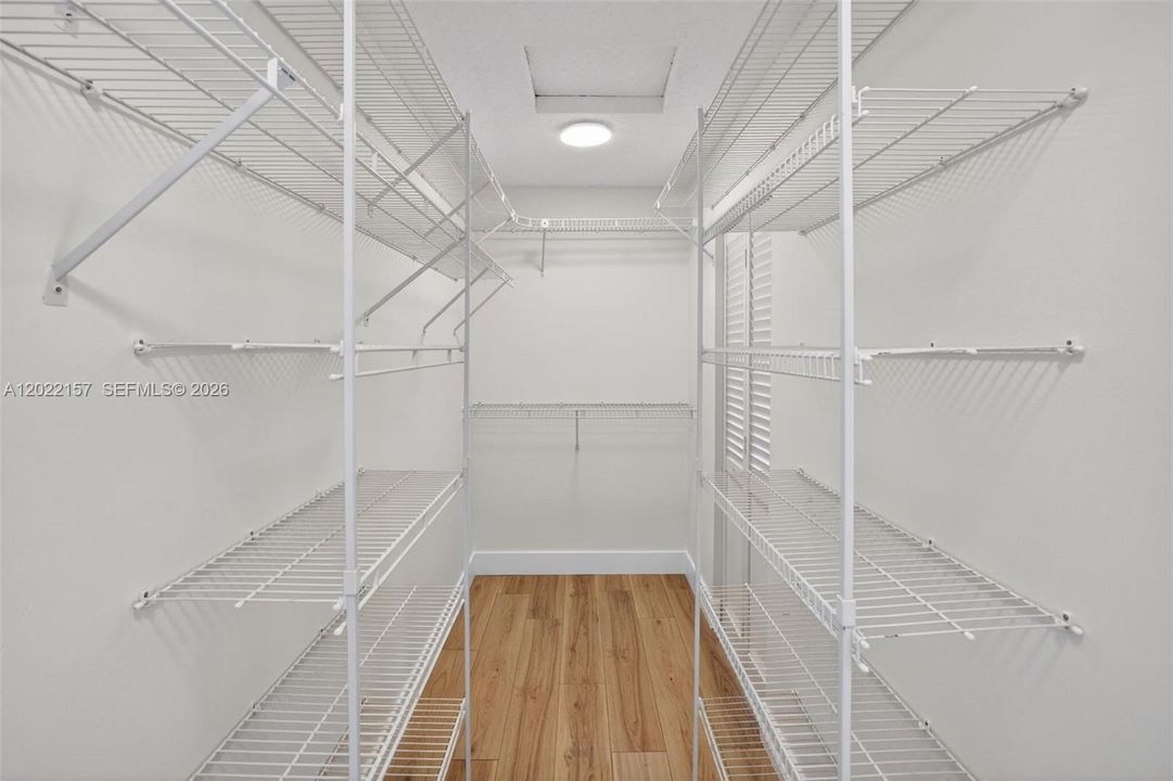 Large primary walk in closet w/ 2 entrances