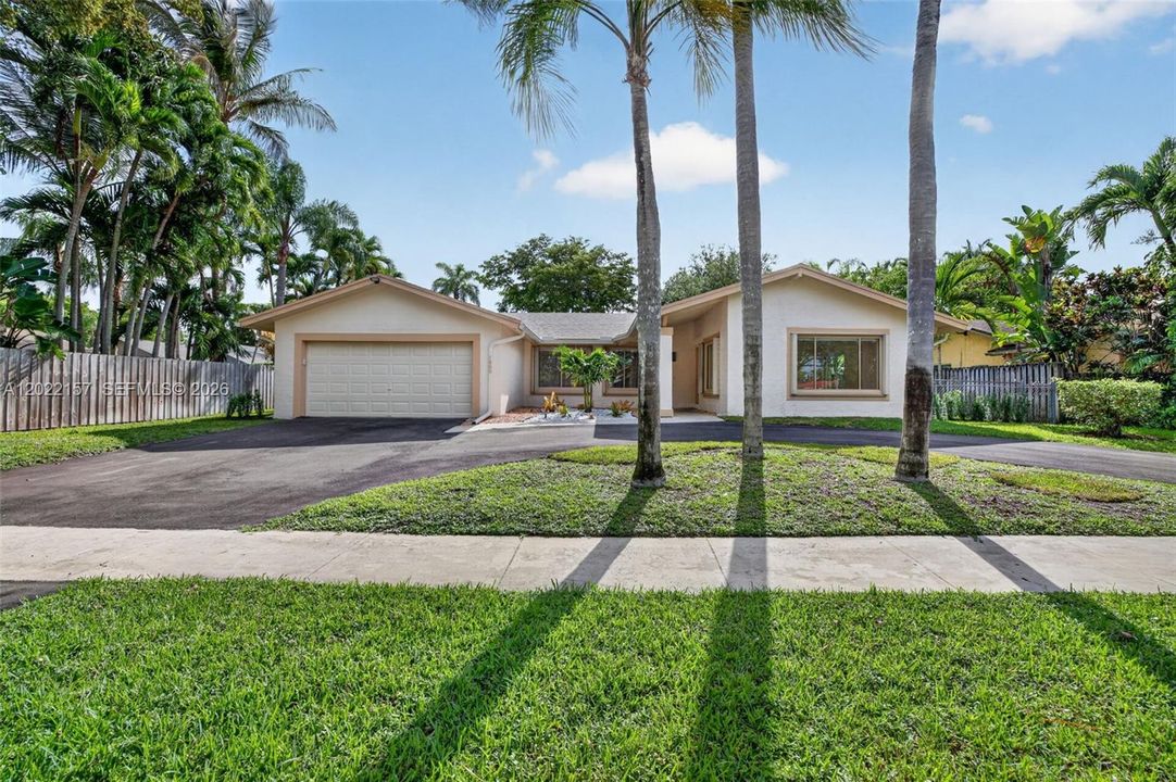 Front of House w/ large circular driveway, gorgeous curb appeal and new front entrance landscaping!