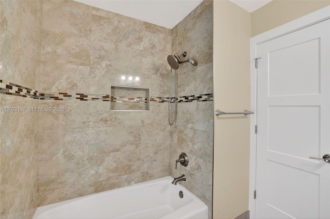 Cabana Bathroom, door to pool area. Combo tub /shower