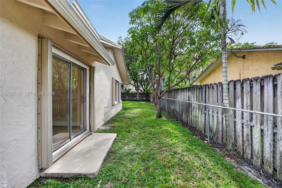 side of property from the formal living room / dining area