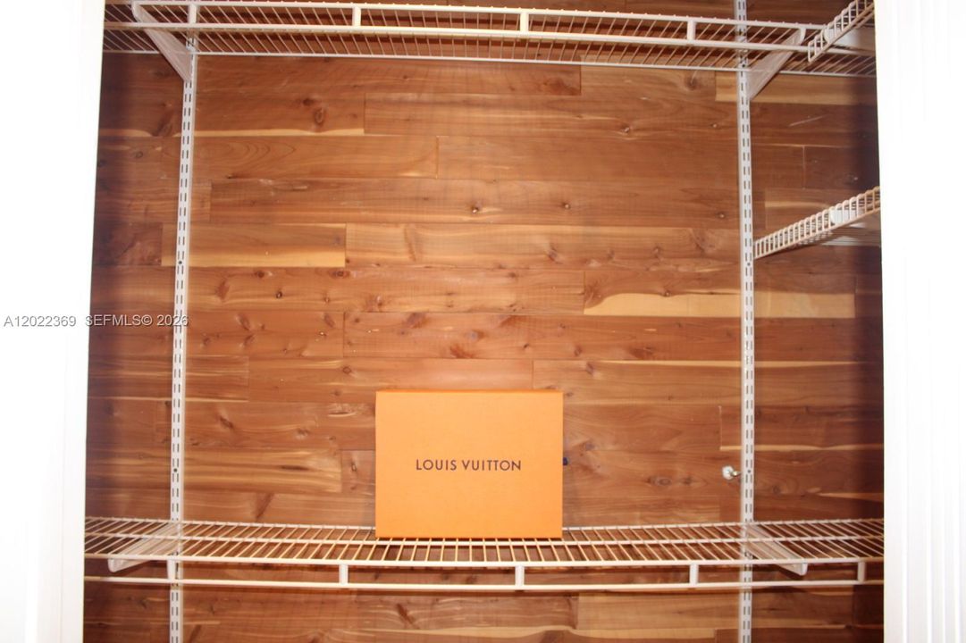 Primary bedroom walk-in closet