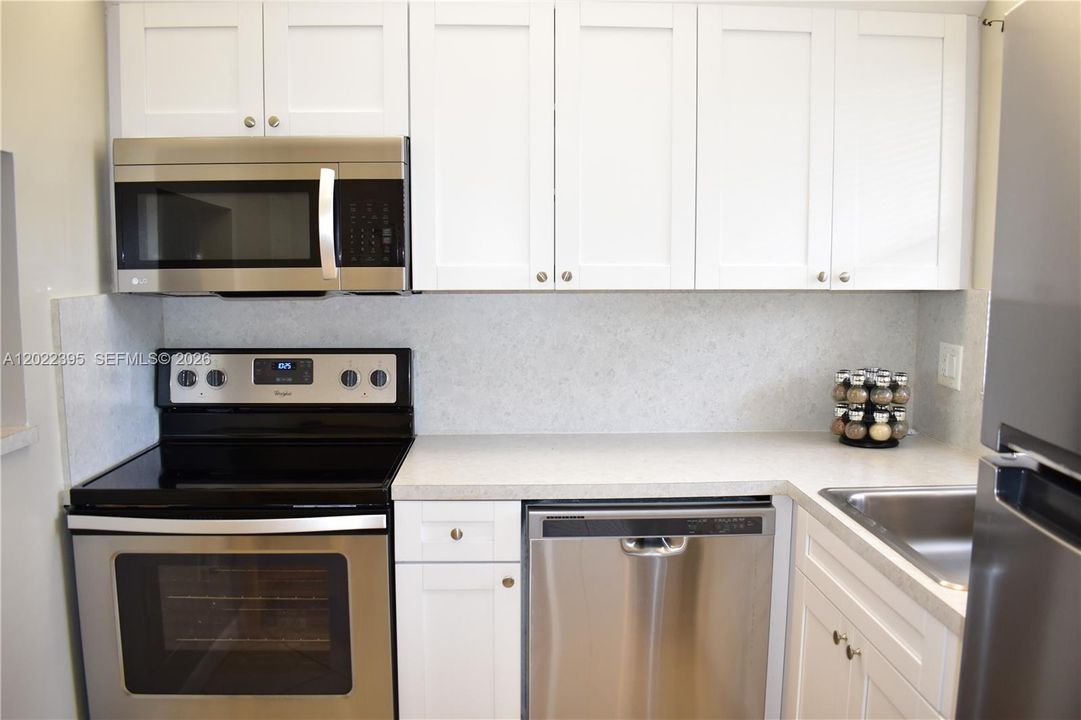 white cabinets and SS appliances