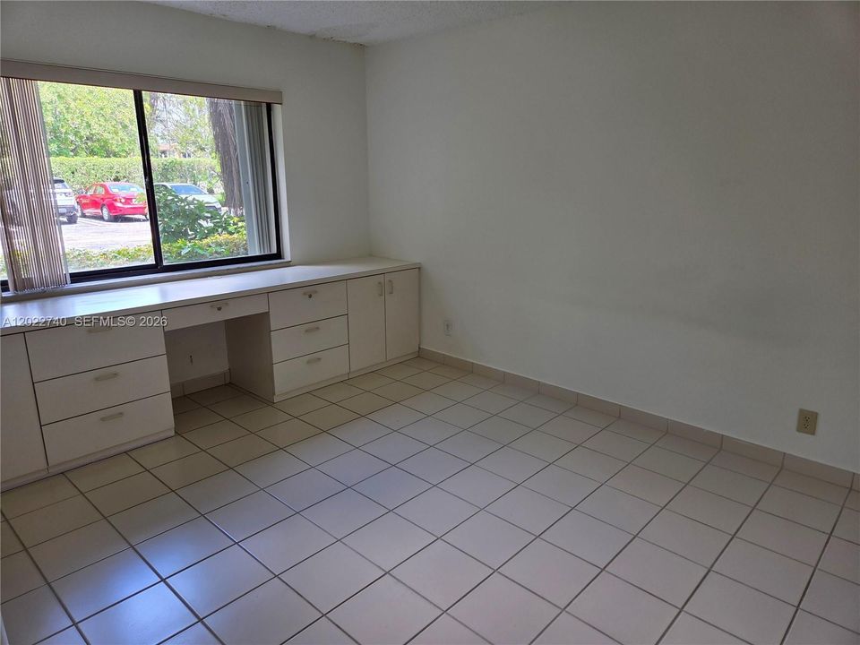 Bedroom 2 with a built in Desk.