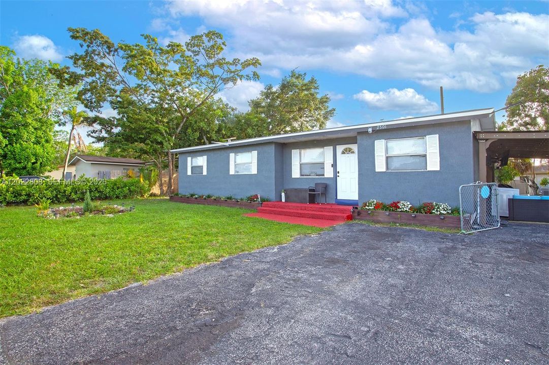 Charming curb appeal with a spacious yard, ample parking.