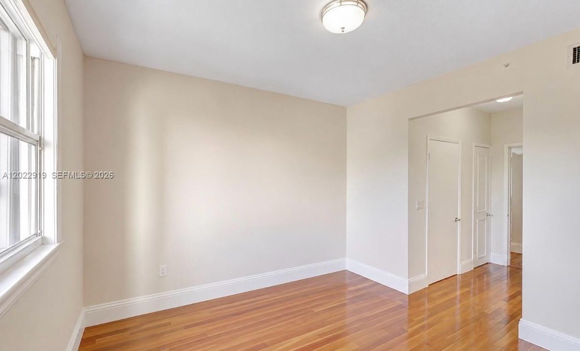 2nd bedroom with 2 closets and bathroom
