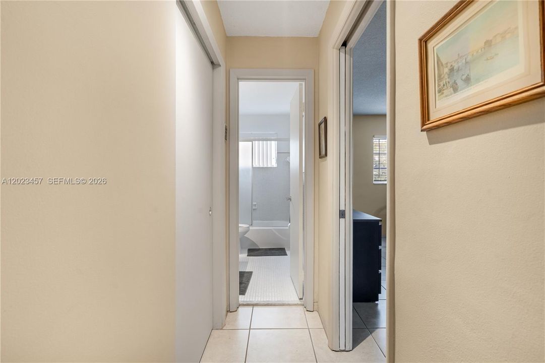 hallway to bedroom and bathroom from dining and living room