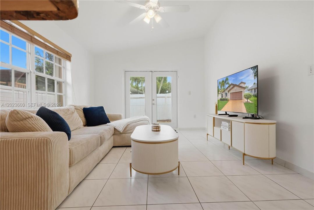 family room near kitchen and patio doors to outside backyard patio