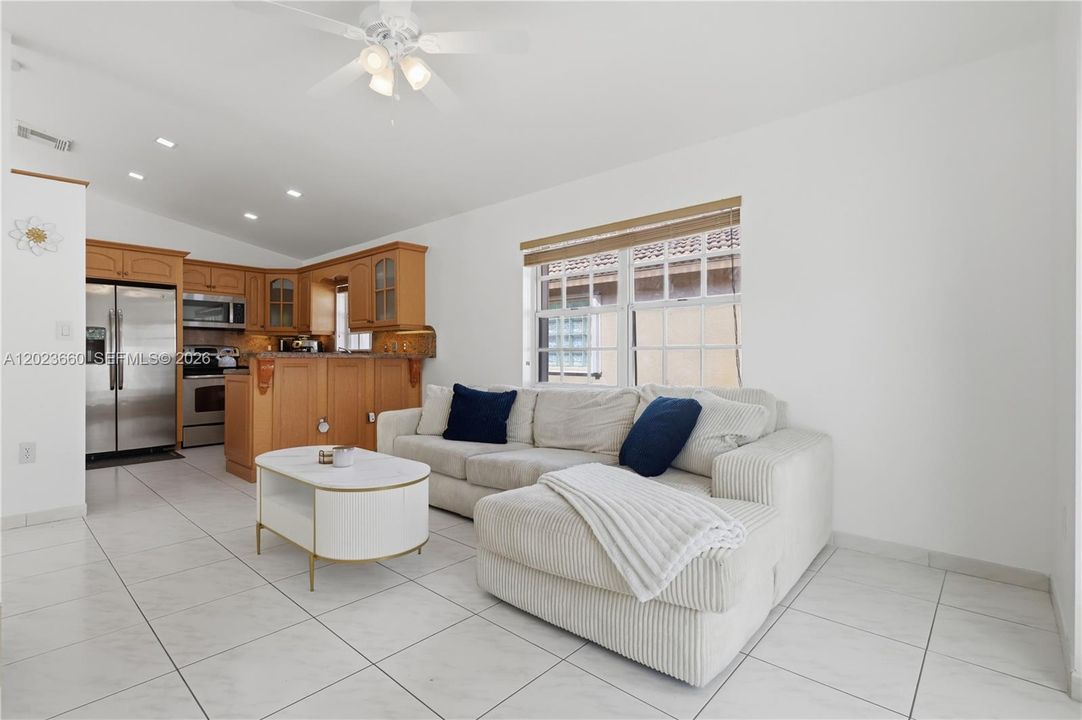 family room near kitchen and patio doors to outside backyard patio