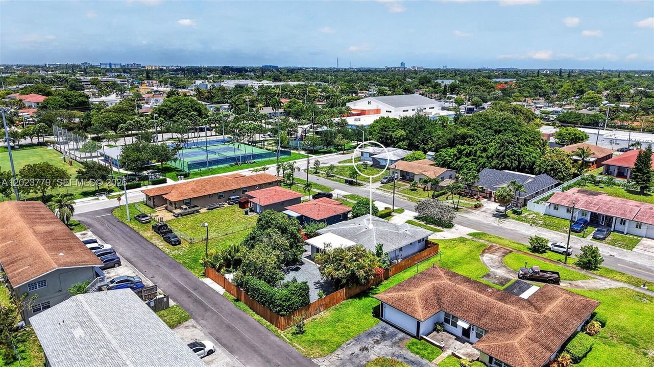 View to the city park with tons of amenities (Gym, Tennis, Playgrounds etc for just $11/month). Notice the front and back streets and access points.