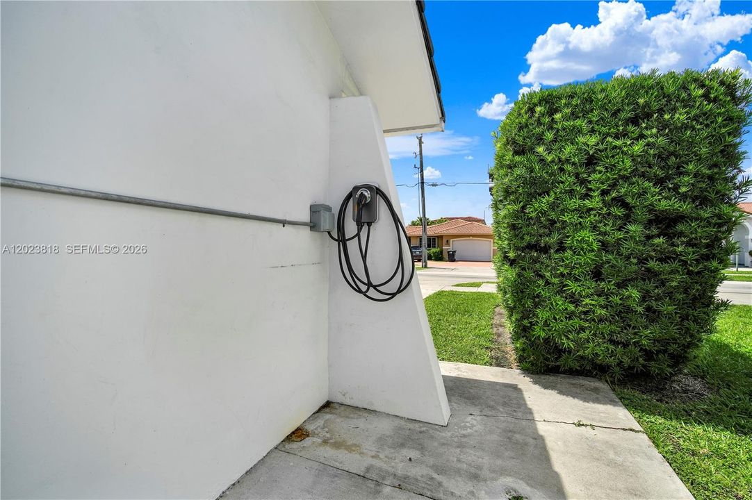 Electrical car charging station on site.