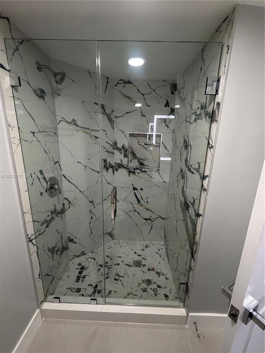 Glass shower doors in both bedrooms