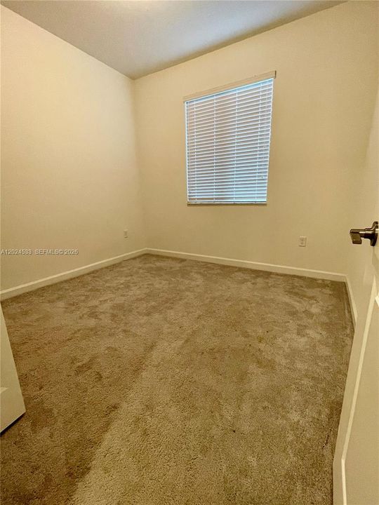 Third bedroom with ceiling fan, blackout and shade