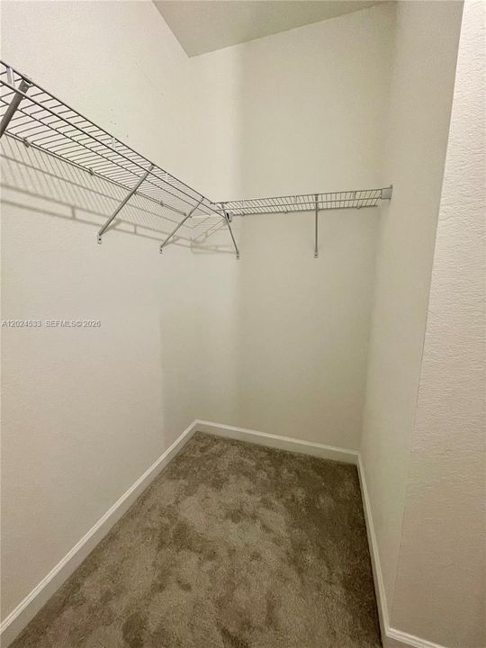 Large walk-in closet at primary room