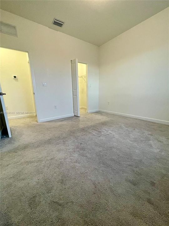 Second Bedroom with ceiling fan, blackout and shade