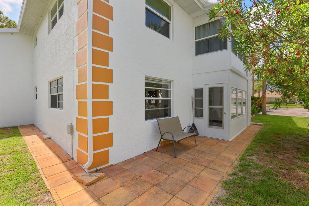 EXTERIOR BACK. PATIO AROUND UNIT