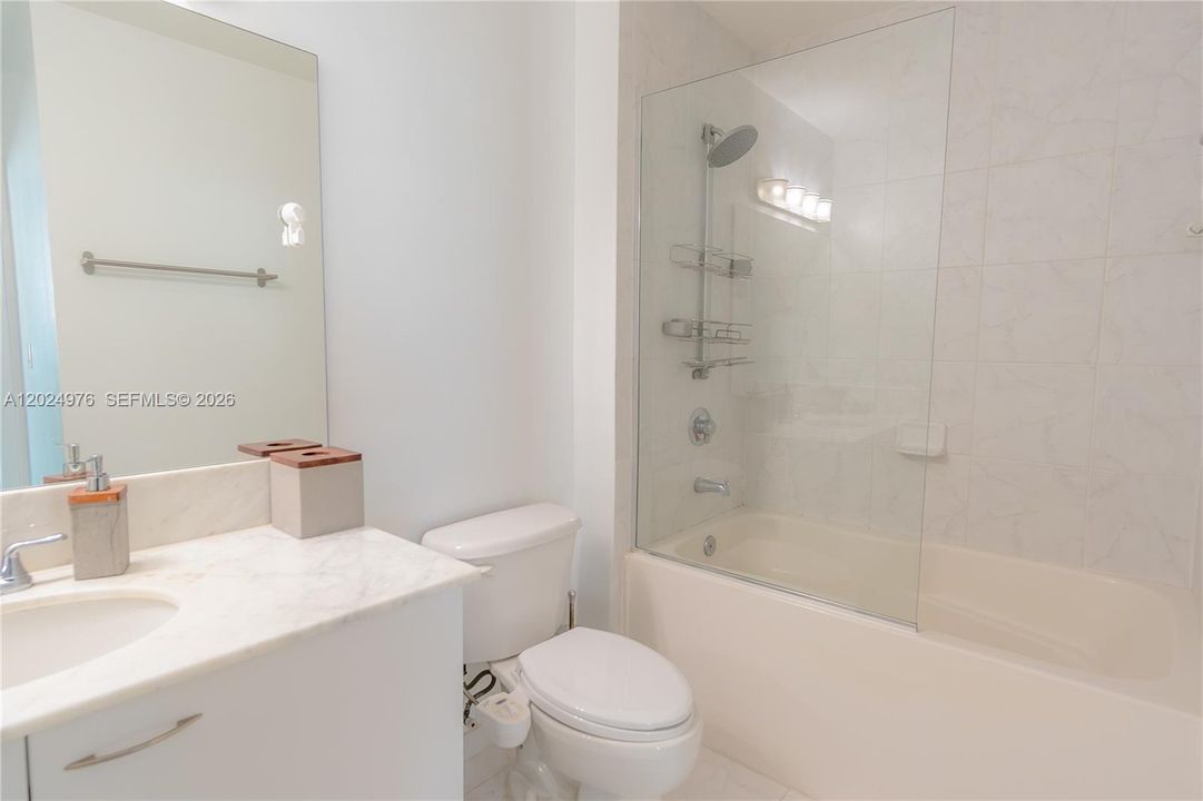 Primary Bathroom w/ Marble Countertops and Custom Tile + Glass Shower (You won't find this in other units)