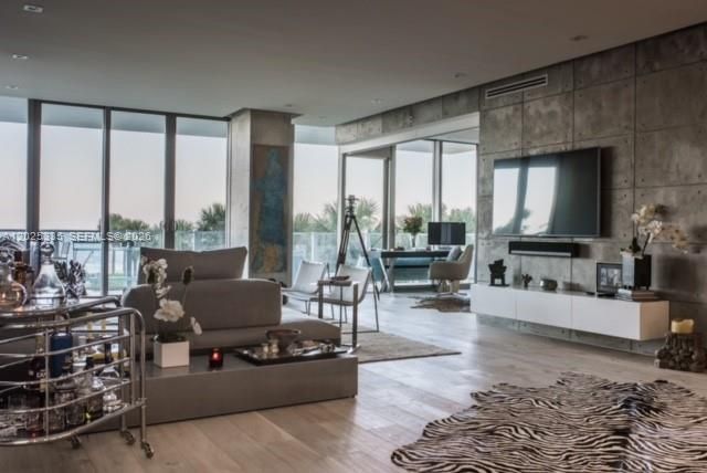 Living area with open den with sliding door for privacy