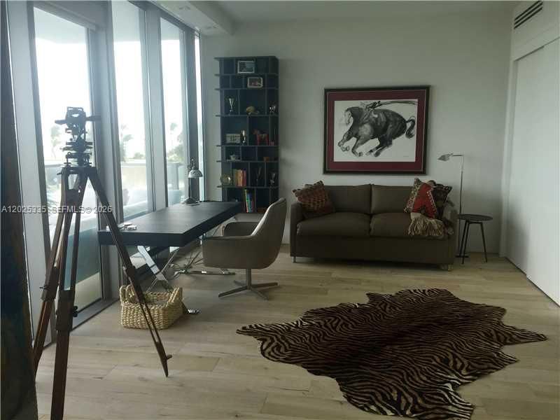 2nd Bedroom converted to Office/den with leather  sleeper sofa & expansive sliding door for privacy