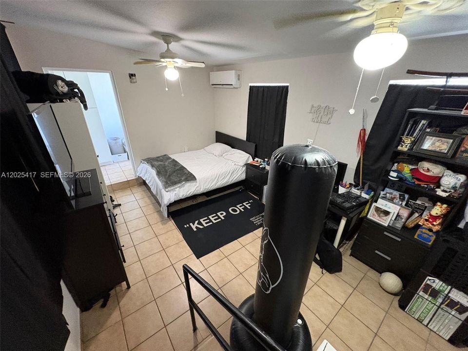 Den currently being used as an extra bedroom.