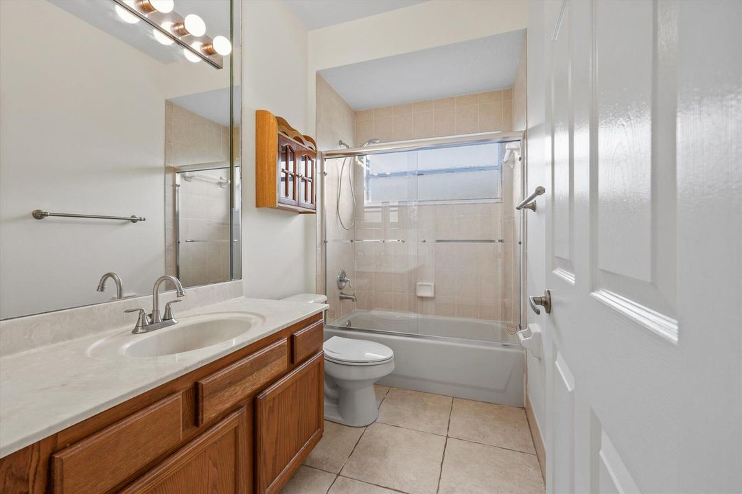 GUEST BATH. CABINETS WILL BE REPAINTED