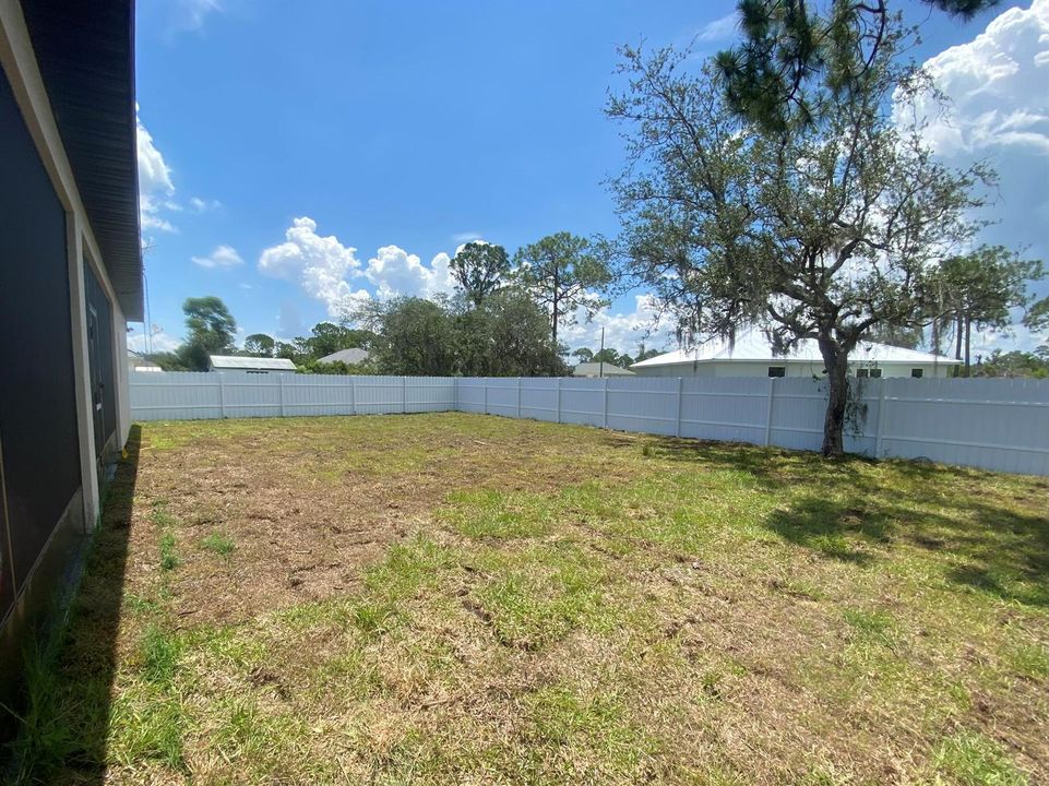 fenced back yard ready for your pool