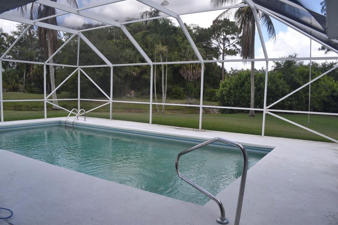 Pool screen enclosed view .39 acre