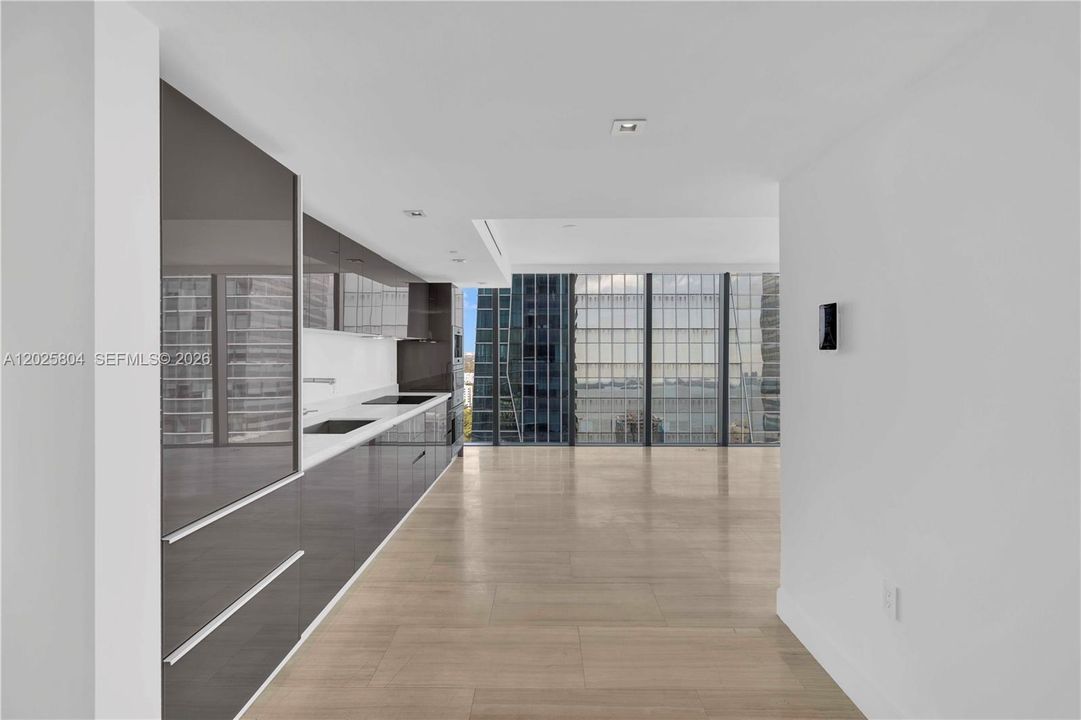 Living room and open kitchen entrance.