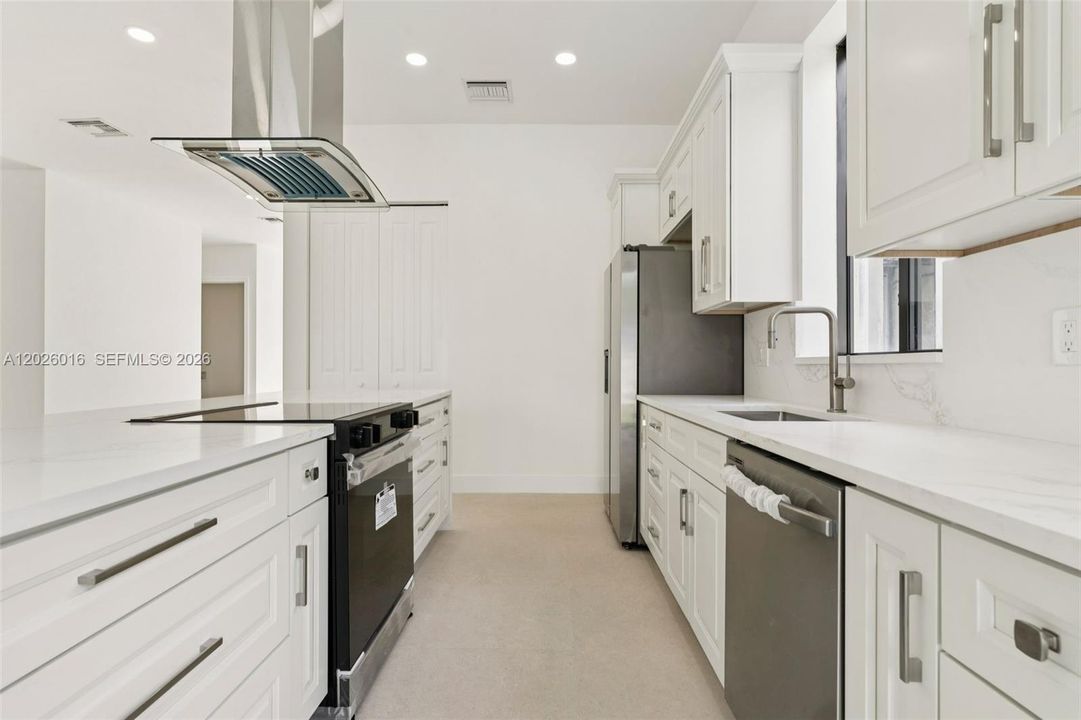 Photos shown are of a completed unit with the same layout and styling; the available unit is currently under construction and may vary.