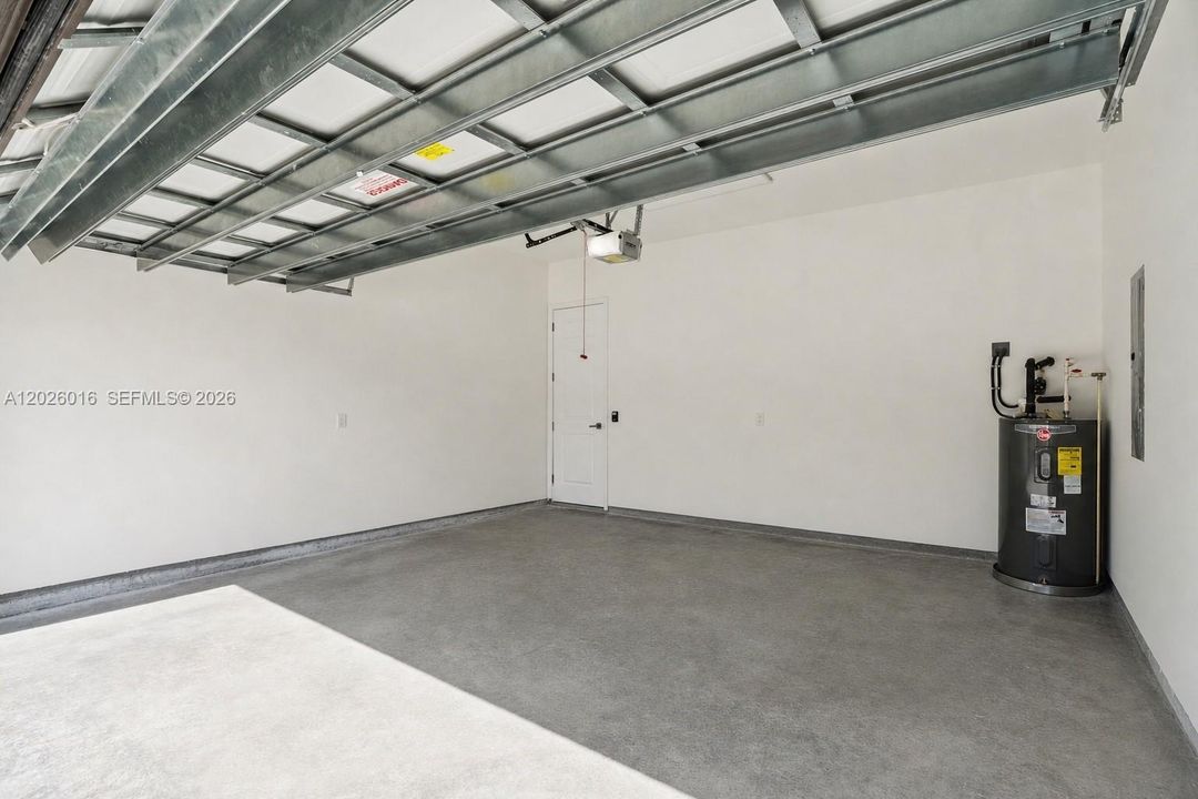 Photos shown are of a completed unit with the same layout and styling; the available unit is currently under construction and may vary.