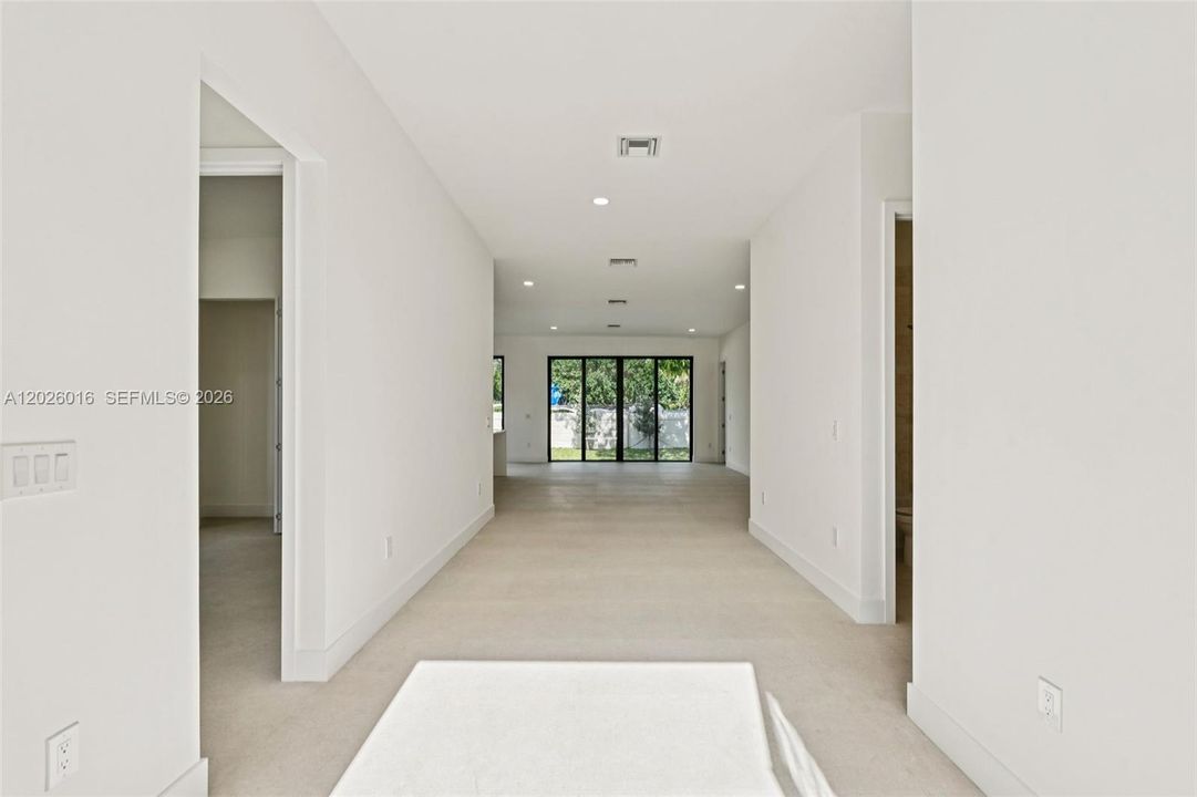 Photos shown are of a completed unit with the same layout and styling; the available unit is currently under construction and may vary.