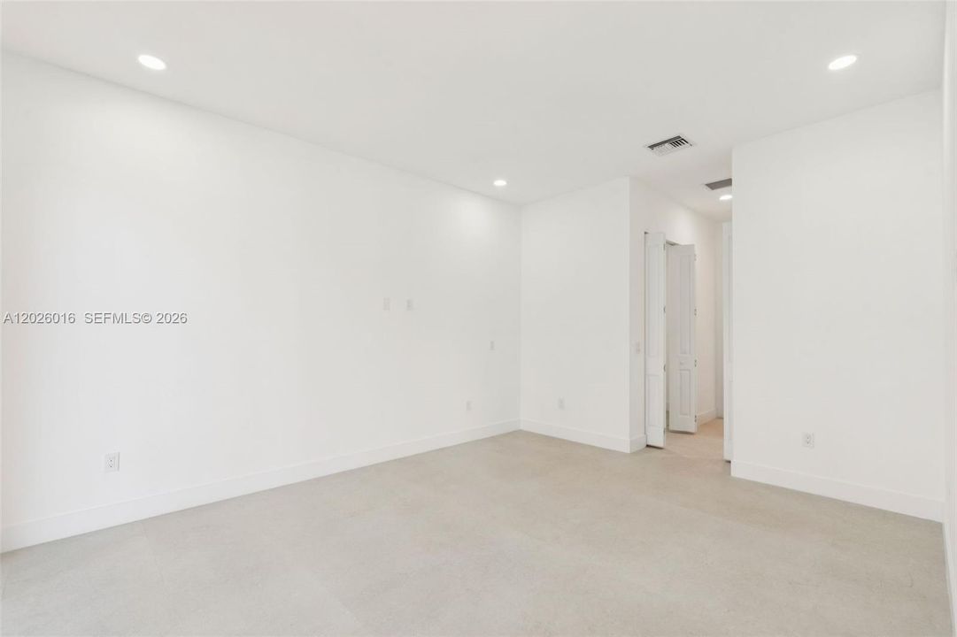 Photos shown are of a completed unit with the same layout and styling; the available unit is currently under construction and may vary.
