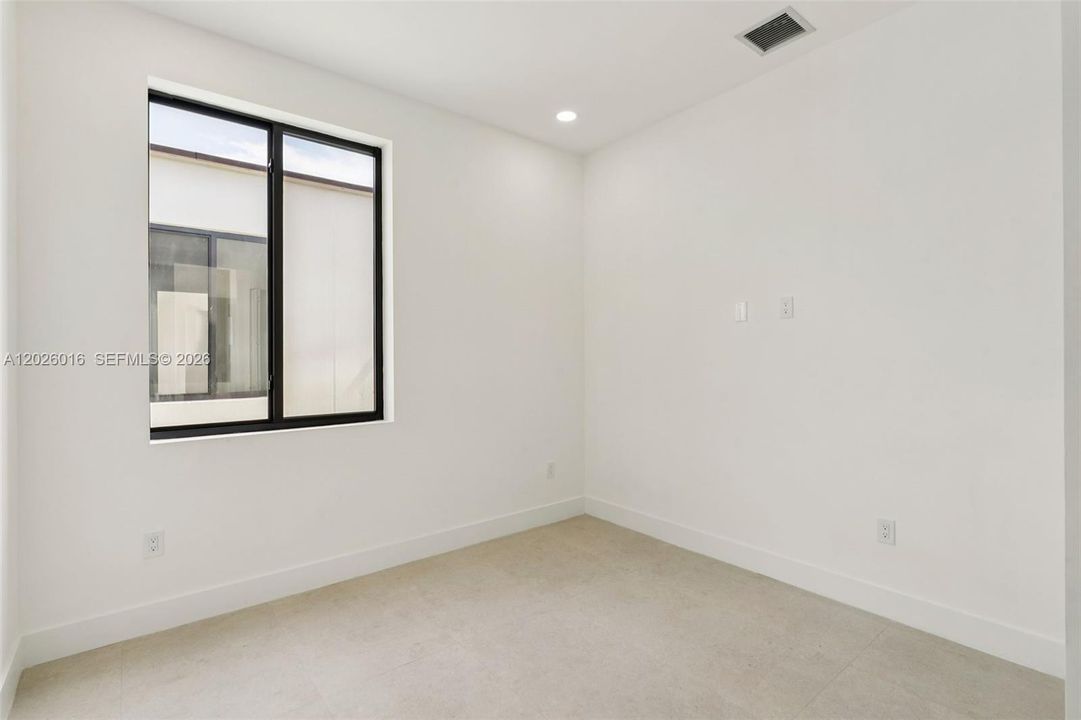 Photos shown are of a completed unit with the same layout and styling; the available unit is currently under construction and may vary.