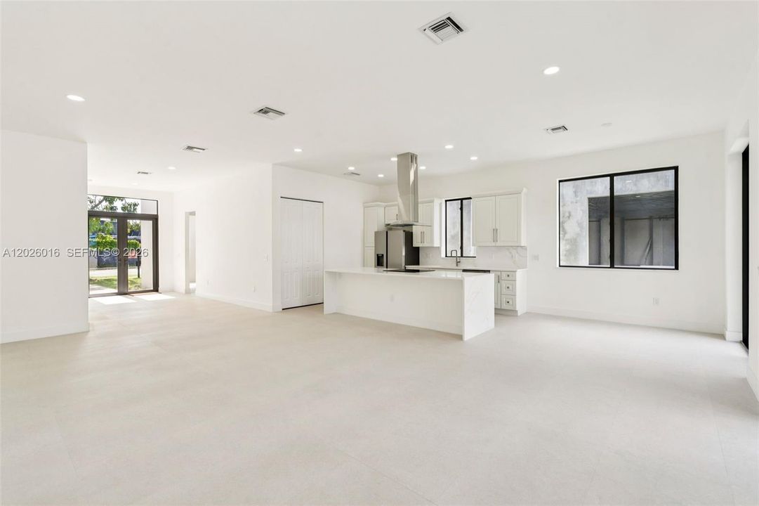 Photos shown are of a completed unit with the same layout and styling; the available unit is currently under construction and may vary.
