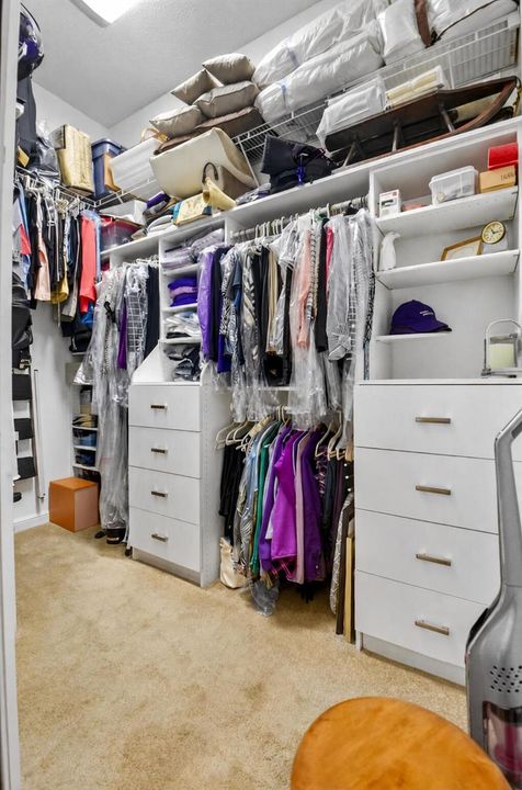 1 of 2 walk-in primary closet