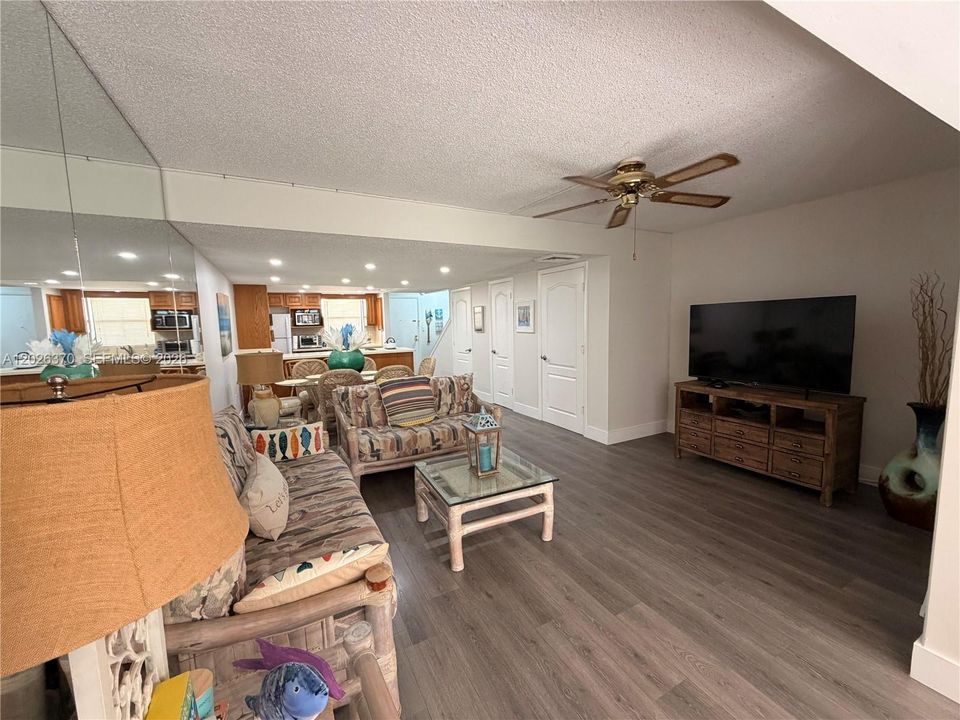 FULLY FURNISHED OPEN CONCEPT LIVING ROOM WITH UPDATED FLOORS