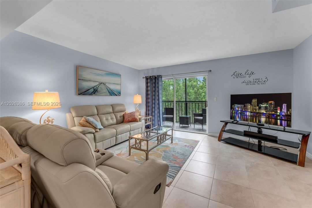 OPEN CONCEPT FAMILY ROOM WITH BEAUTIFUL OUTDOOR BALCONY