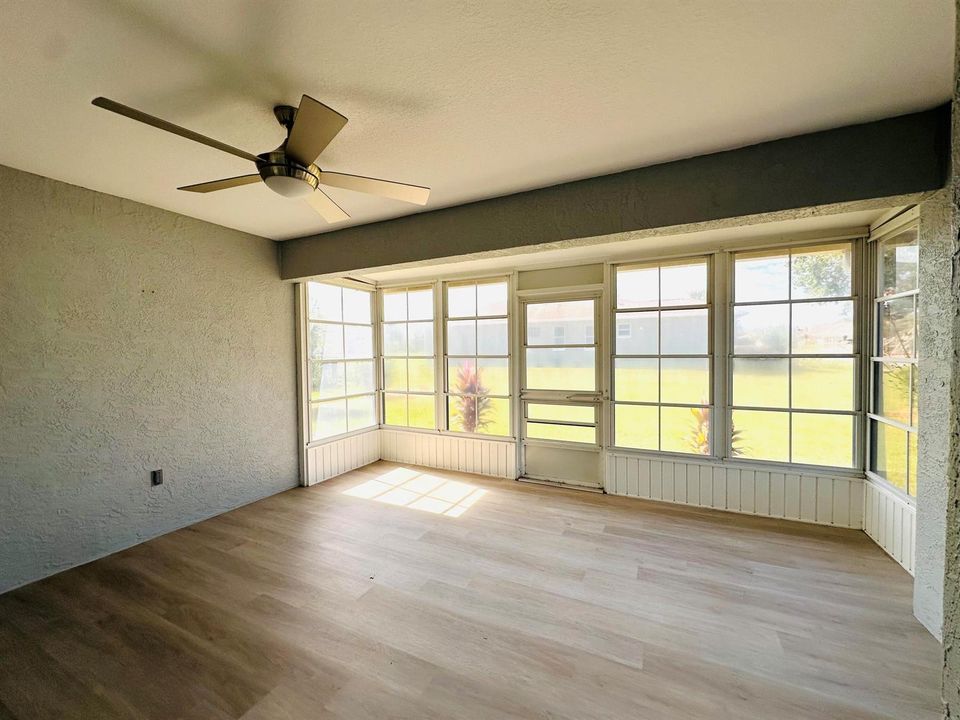 ENCLOSED PORCH OVERLOOKS GARDEN