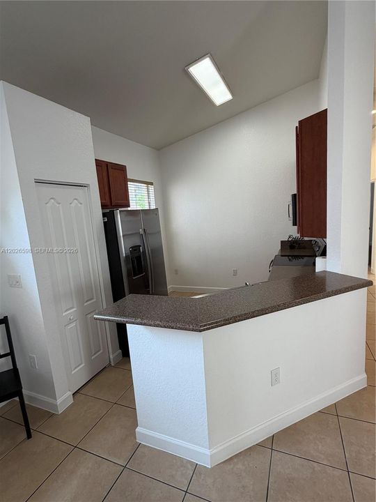 There is space in the kitchen for a breakfast nook>