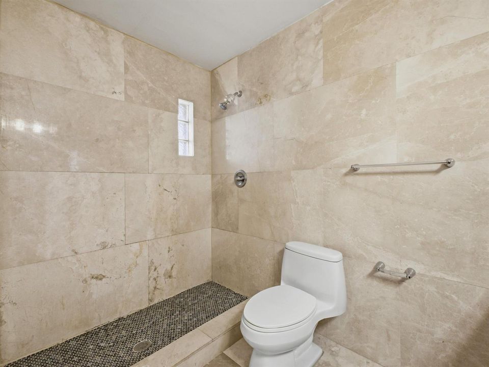 Primary Bathroom Shower and Toilet